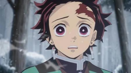 Who spoke to Tanjiro in his dream and warned him to wake up?