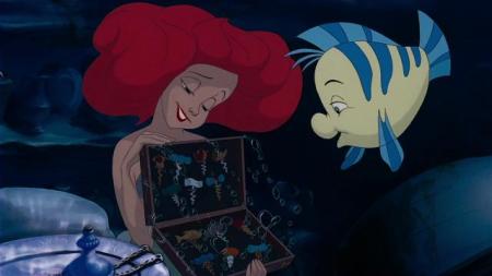 Complete the song: "While we ____ , full time to floatin'. Under the sea (Ah-ha-ha)"